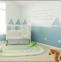 Nautical sailboat nursery theme decorated in blue for a baby boy