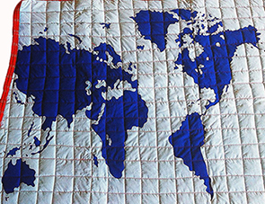 World map applique quilt pattern for a baby nursery or kids room bedding