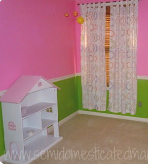 Baby girl nursery room with bright pink and lime green wall paint color and white painted trim